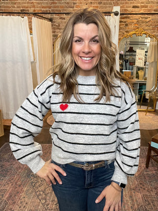 Grey striped sweater with red heart detail