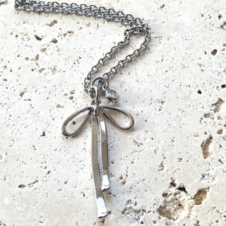 Melted ribbon bow charm necklace: silver